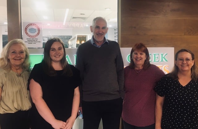 Optometrist Philip Brinin (centre) with his team (from left) Sandy, Tiffany, Noelene and Karen.